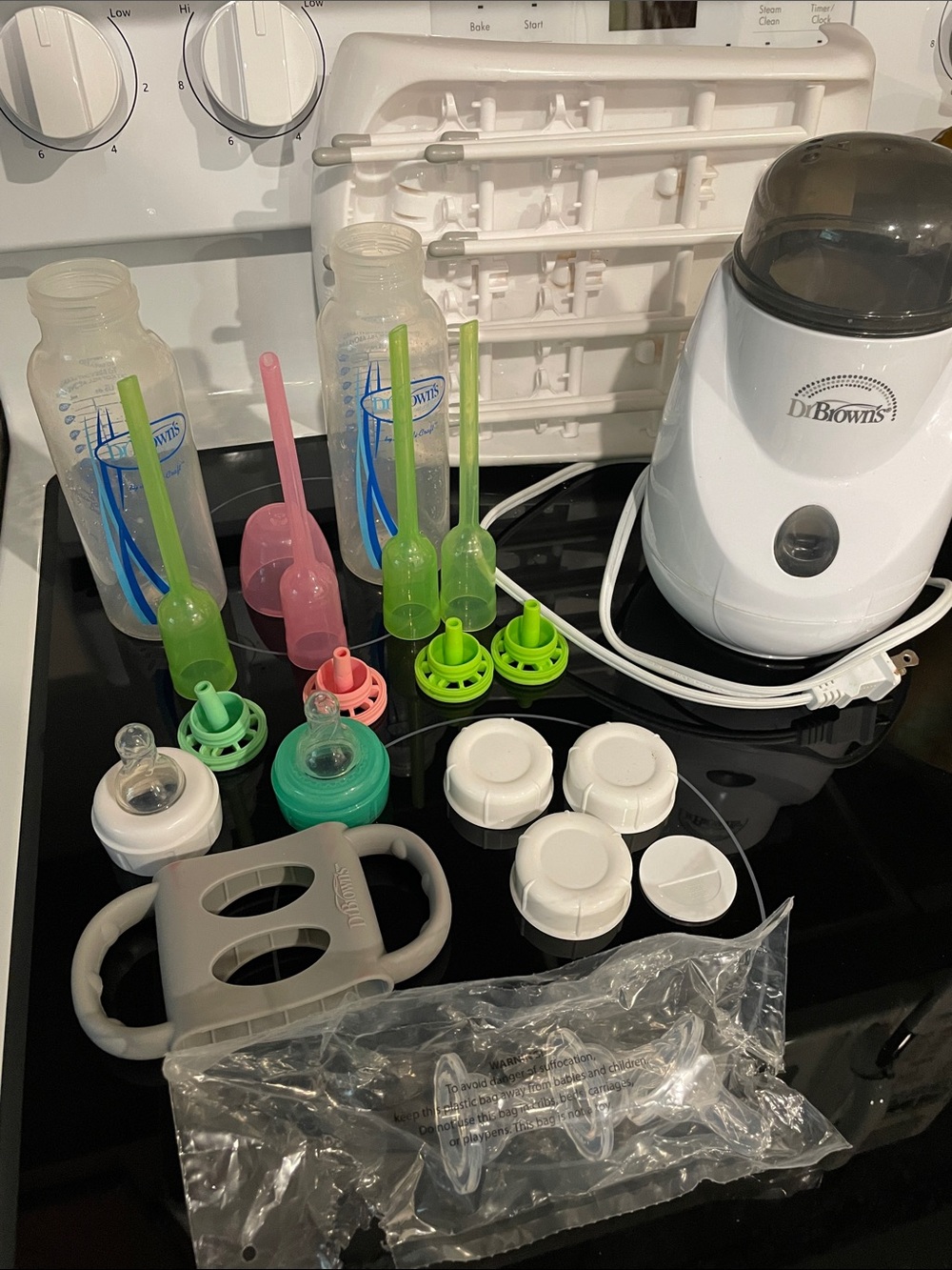 Dr. Brown’s Bottle Warmer with Pink & Green bundle of bottle stuff and dry rack